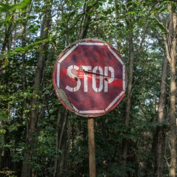 Here's a captivating image showcasing a vandalized stop sign that will surely catch your attention.