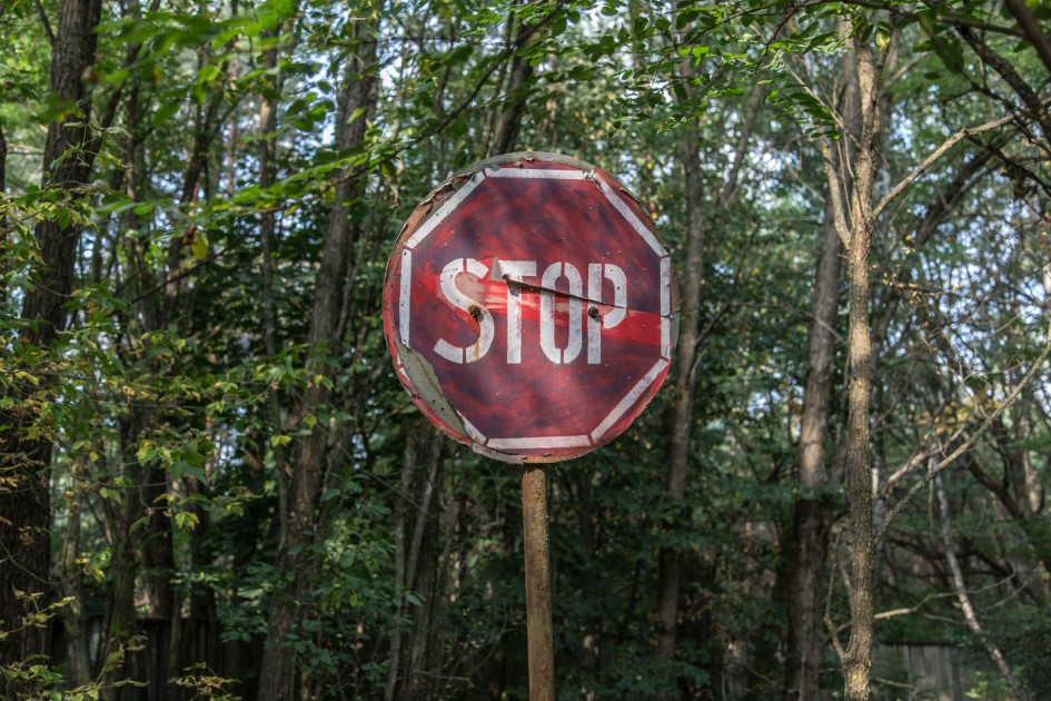 Here's a captivating image showcasing a vandalized stop sign that will surely catch your attention.